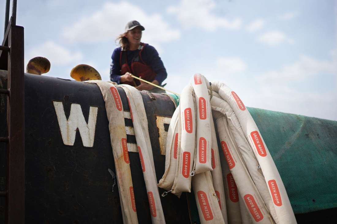 Green Boom booms deployed from a vessel